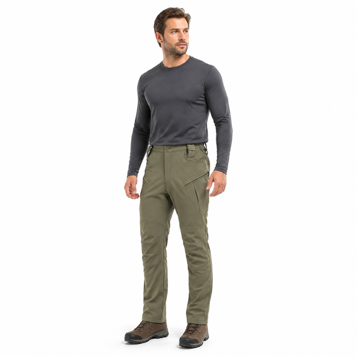 Men's fleece-lined hiking pants in Army Green worn by a hiker