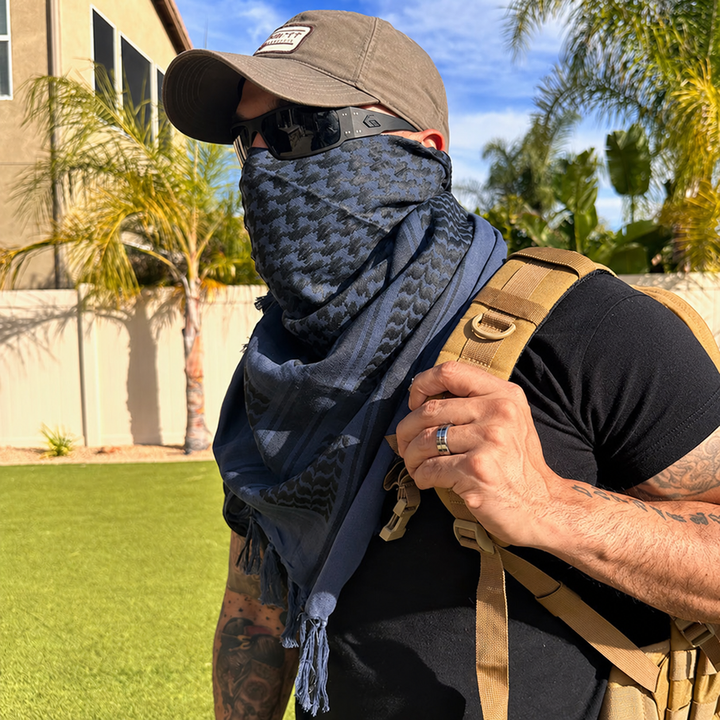 blue shemagh scarf worn outdoors with plain clothing