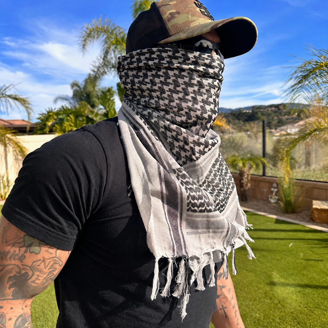 grey shemagh scarf worn outdoors with plain clothing